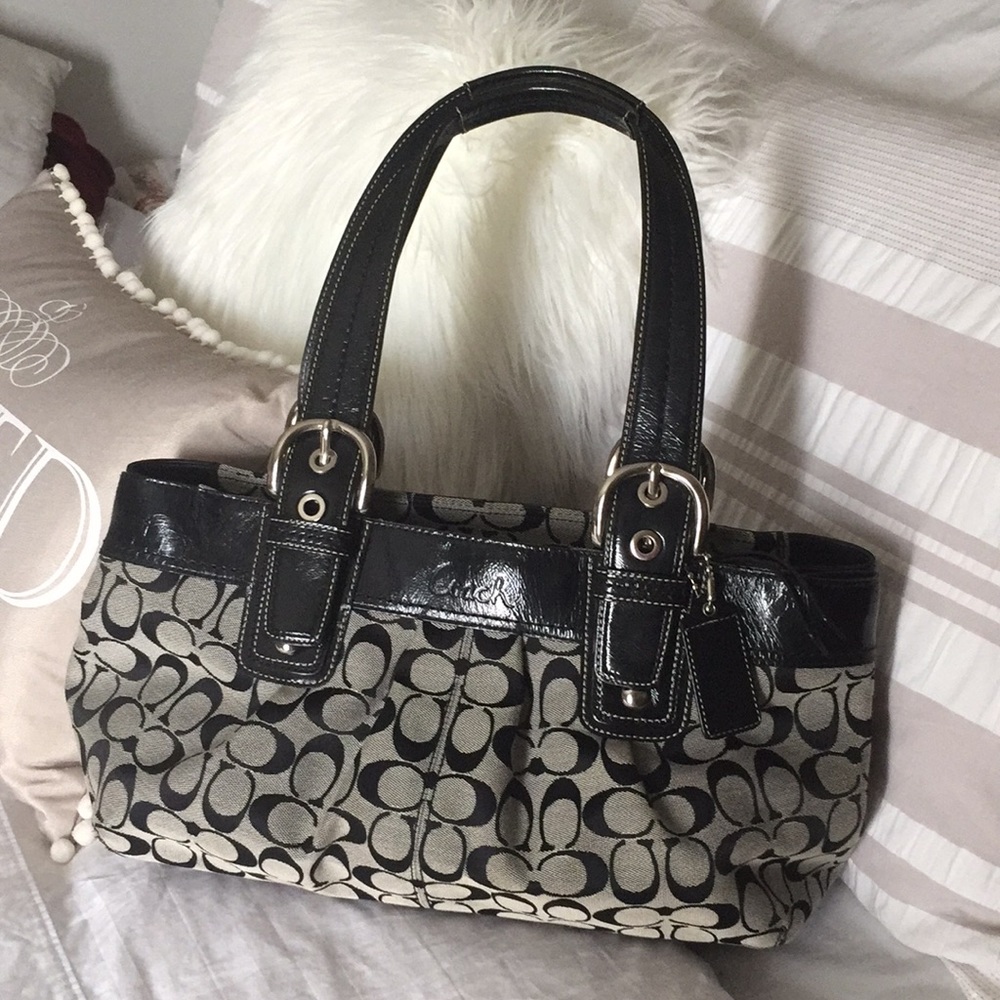Black and gray  coach purse